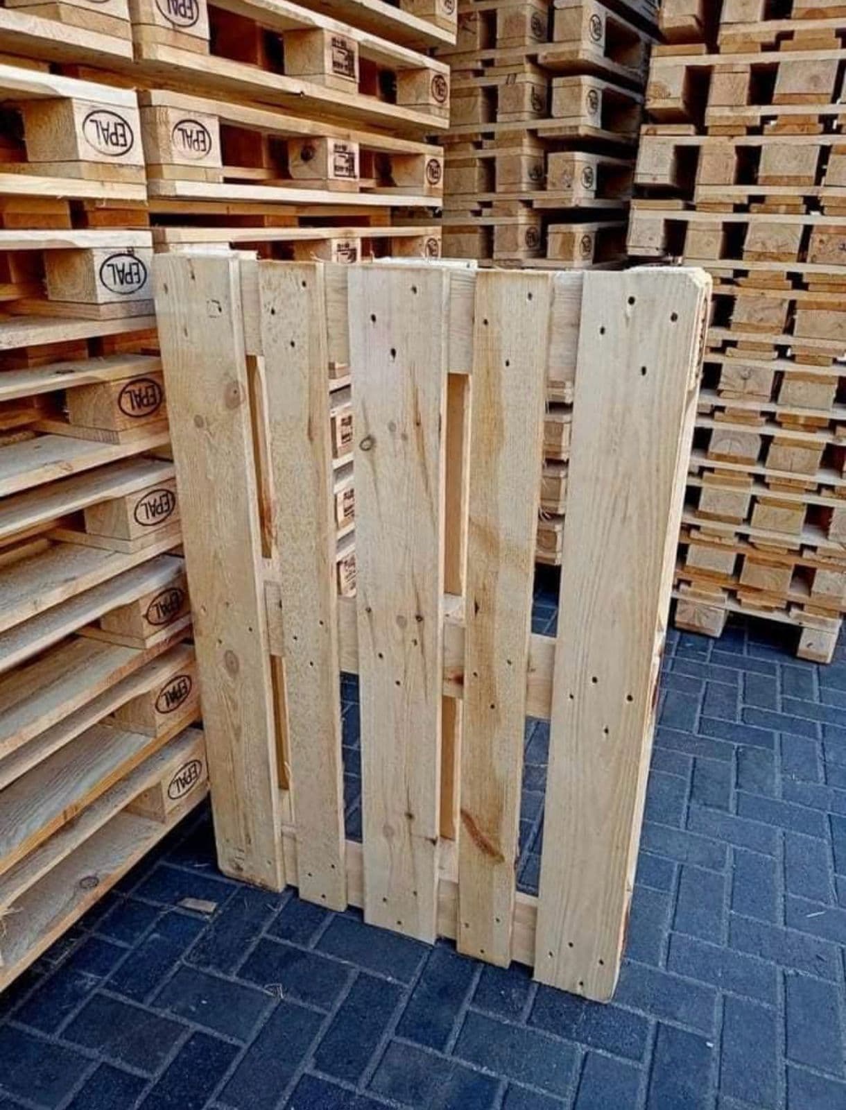EPAL-stamped Euro pallets stacked in the yard